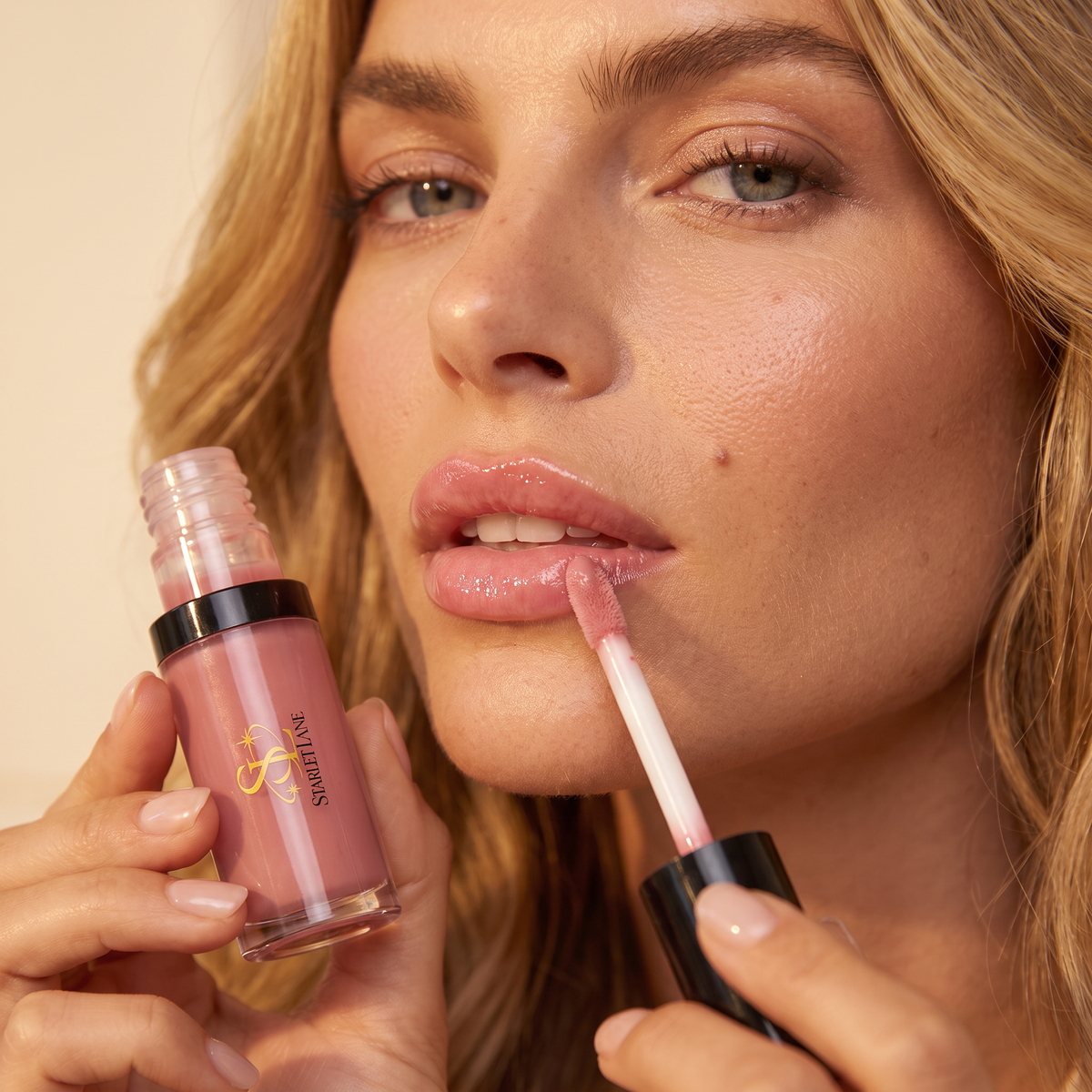 Ava applying Starlet Lane Lip Oil
